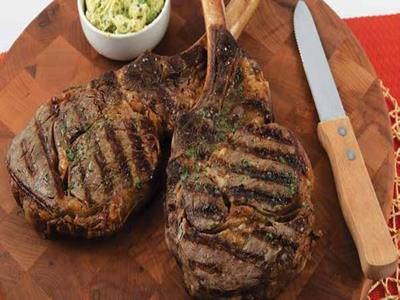 Grilled Tomahawk Ribeye Steaks  with Classic Steak Butter