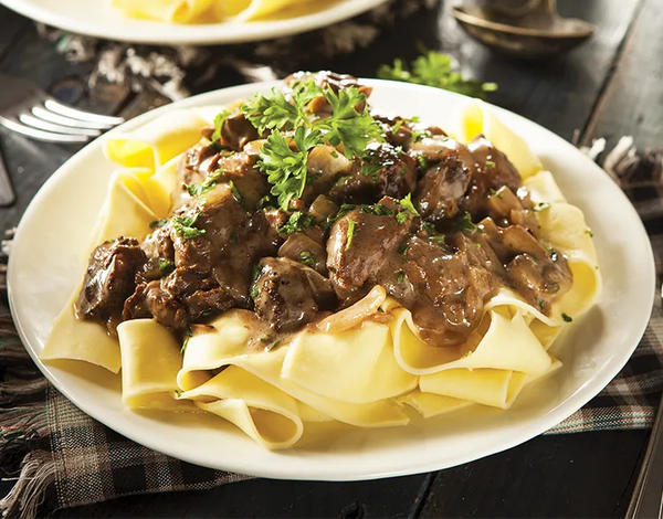 Beef Stroganoff Over Buttered Noodles