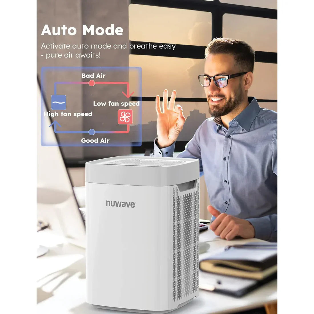 A man working with NuWave portable air purifier on his desk