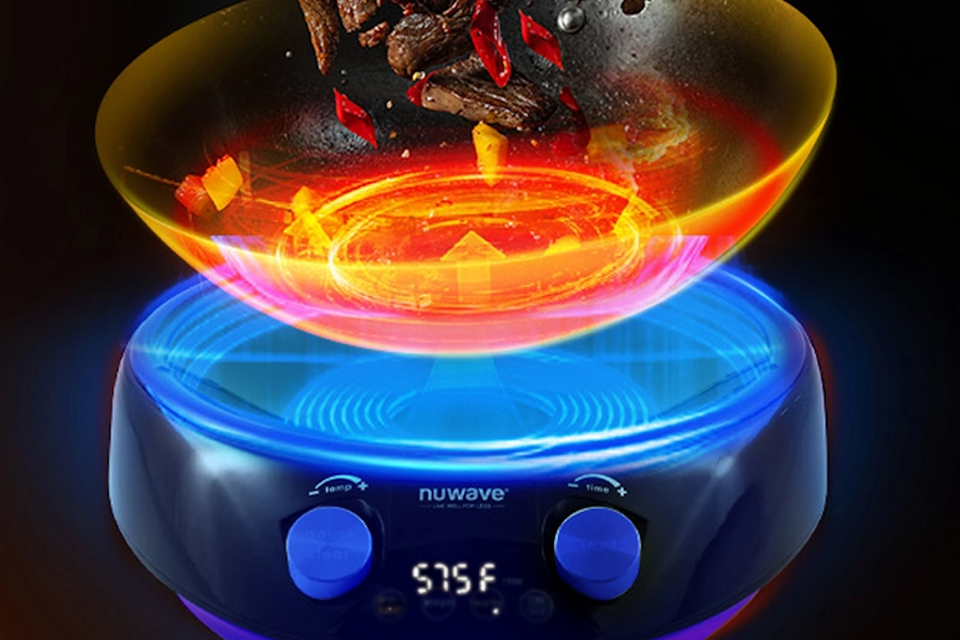 NuWave Mosaic Induction Wok with vibrant heating display and precise temperature control at 575°F