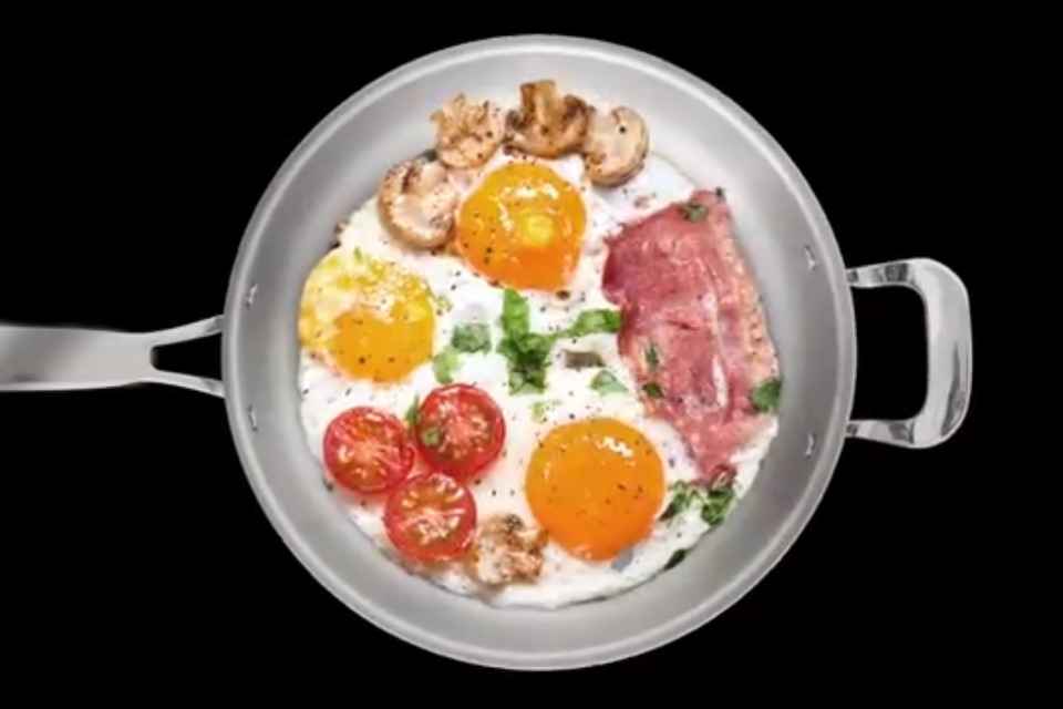 Healthy breakfast with eggs and bacon cooked in a NuWave stainless steel pan