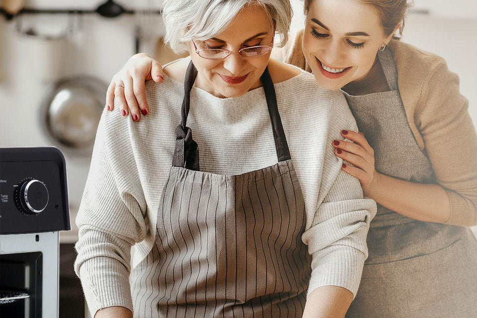 Mom and daughter bonding time cooking with small kitchen appliances.