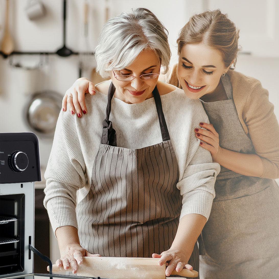 Mom and daughter bonding time cooking with small kitchen appliances.