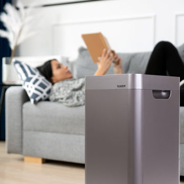 Woman Reading While NuWave OxyPure Air Purifier Cleans the Air