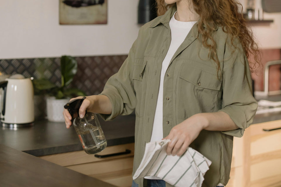 A woman cleaning the table