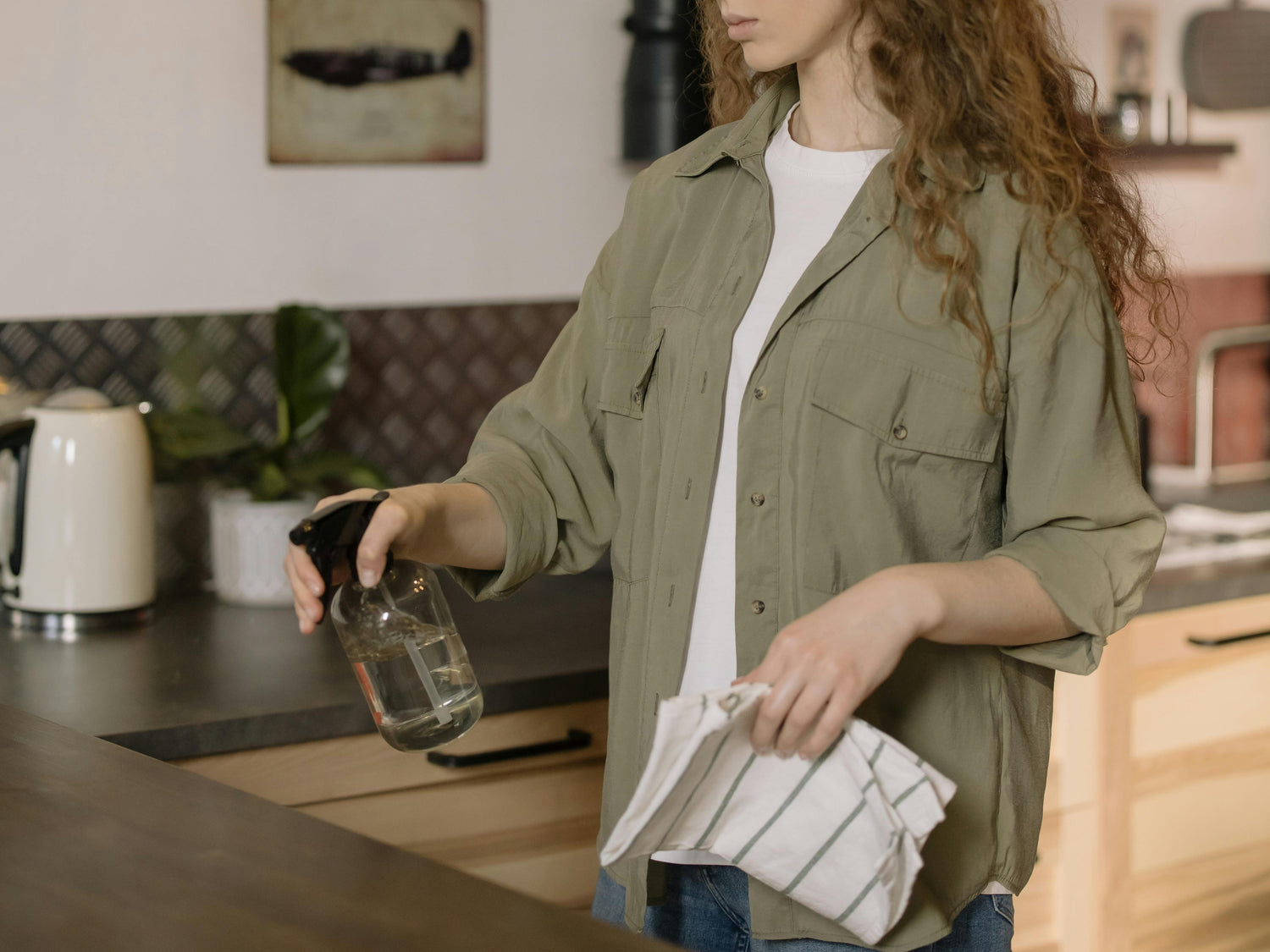 A woman cleaning the table